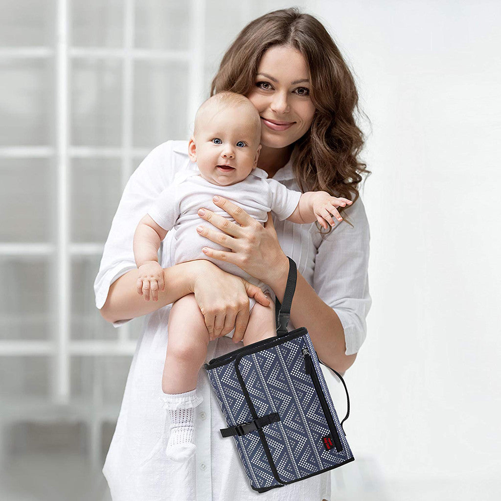 alt: Portable Waterproof Baby Diaper Changing Pad with Travel Mat Headrest and Storage Pockets