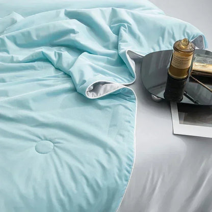 Cooling Blanket made of high-quality, breathable, and soft materials, designed to regulate body temperature, provide comfort during sleep, and suitable for hot weather or warm nights.  
